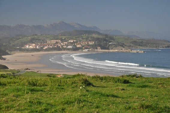 The green coast of North Spain, Crystal clean ocean and wild mountain range of Picos de Europa