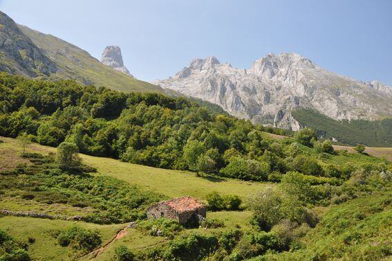 The green coast of North Spain, Crystal clean ocean and wild mountain range of Picos de Europa